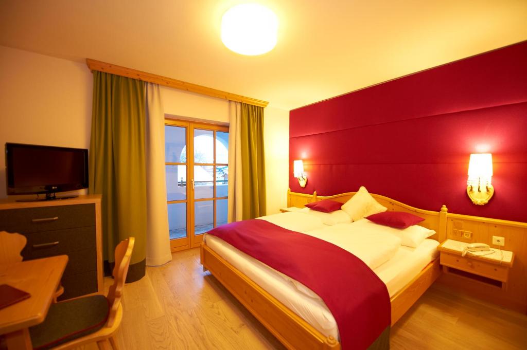 Postel nebo postele na pokoji v ubytování Hotel Lisa