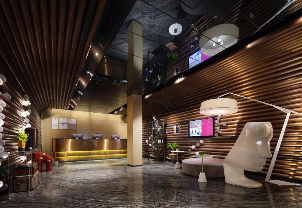 TV a/nebo společenská místnost v ubytování Paco Hotel Guangzhou Jiangtai Road Metro Branch