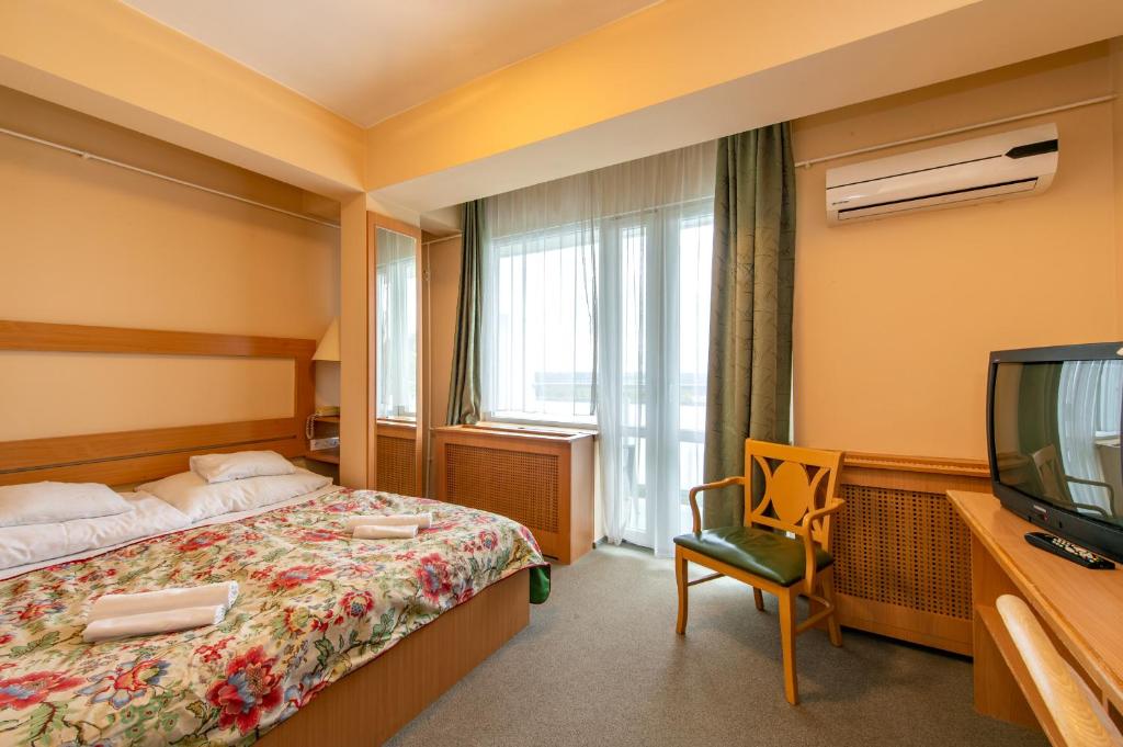 Postel nebo postele na pokoji v ubytování Hotel Fit Hévíz