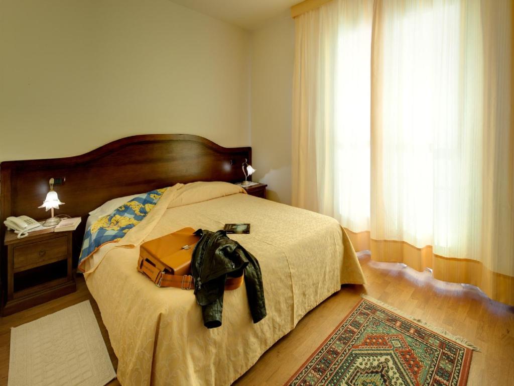 Postel nebo postele na pokoji v ubytování Villa Butussi - L'ospitalità del Vino