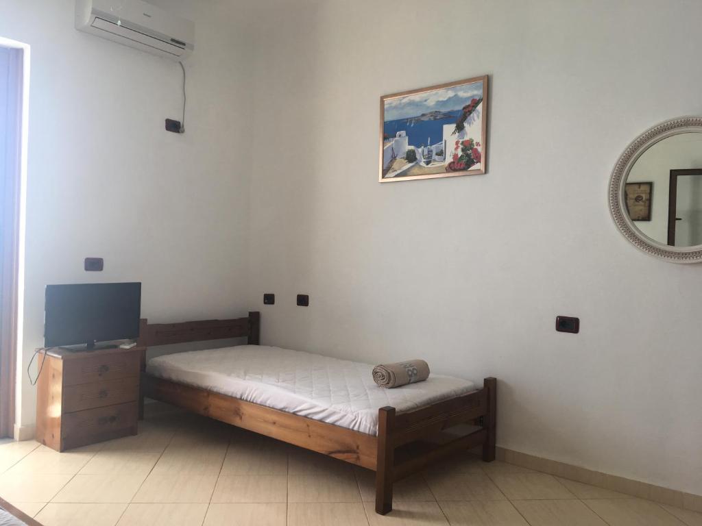 Postel nebo postele na pokoji v ubytování Qeparo Antonio Rooms
