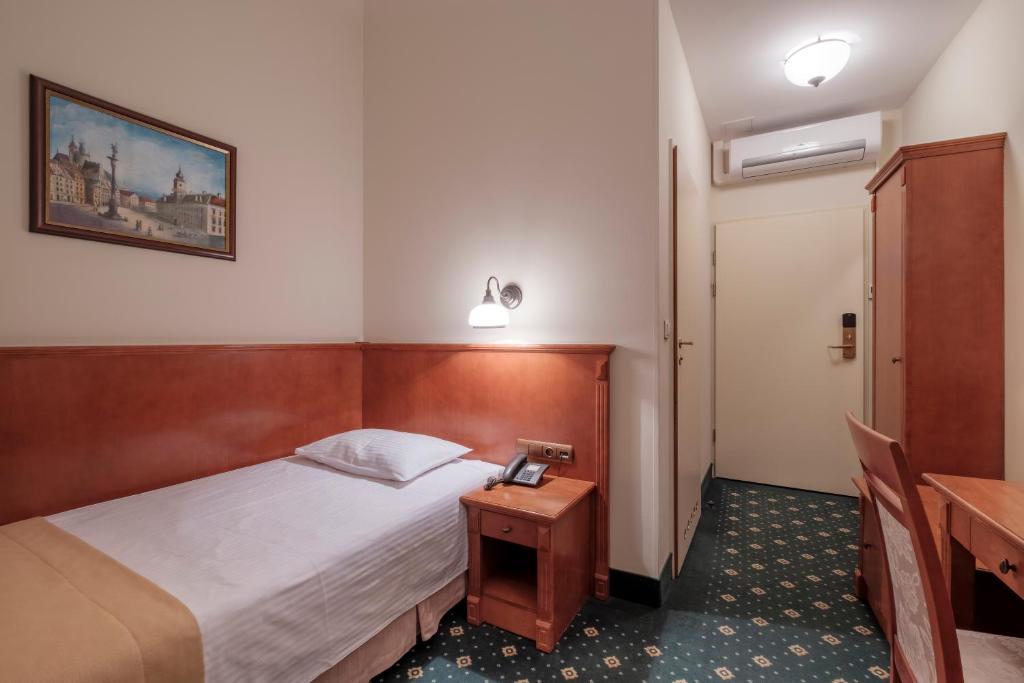 Posteľ alebo postele v izbe v ubytovaní Hotel Hetman