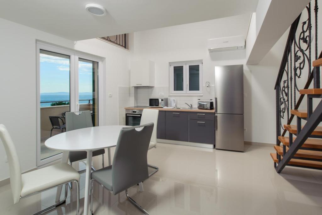 Kuchyň nebo kuchyňský kout v ubytování NERA lux apartment