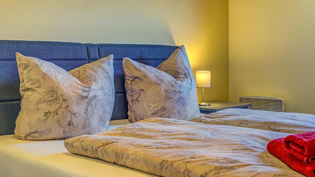 Postel nebo postele na pokoji v ubytování Hotel & Pension Traumblick