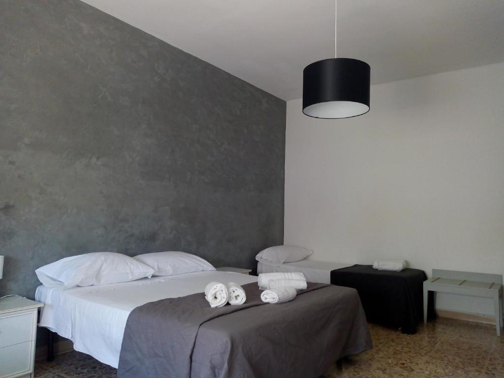 Postel nebo postele na pokoji v ubytování ALGHERO SEASIDE Guest House - Affittacamere