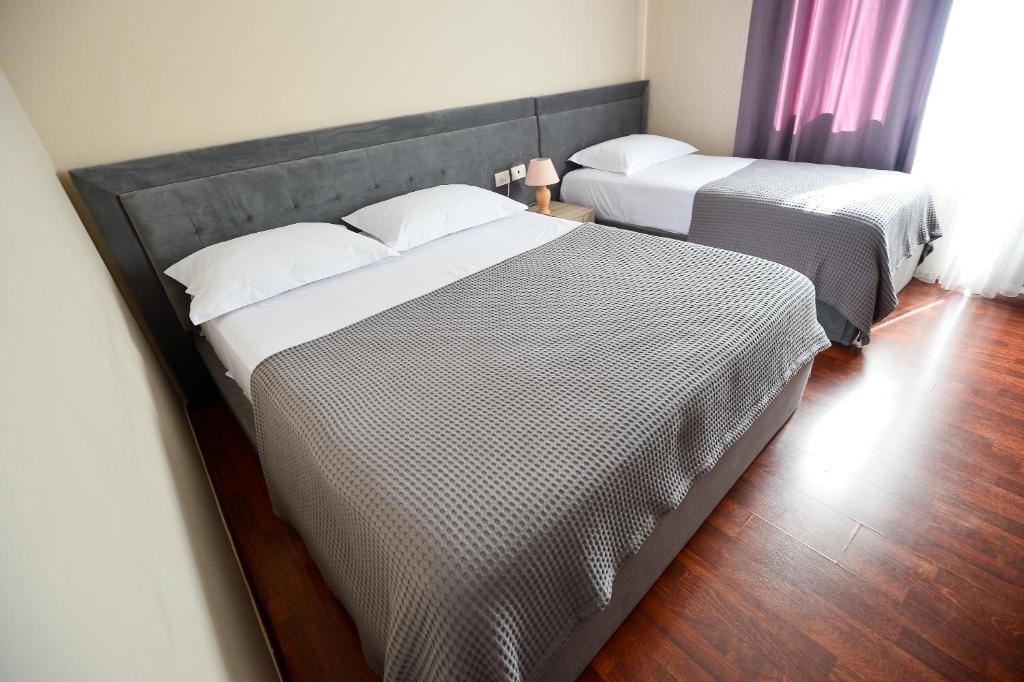 Postel nebo postele na pokoji v ubytování Hotel Niku