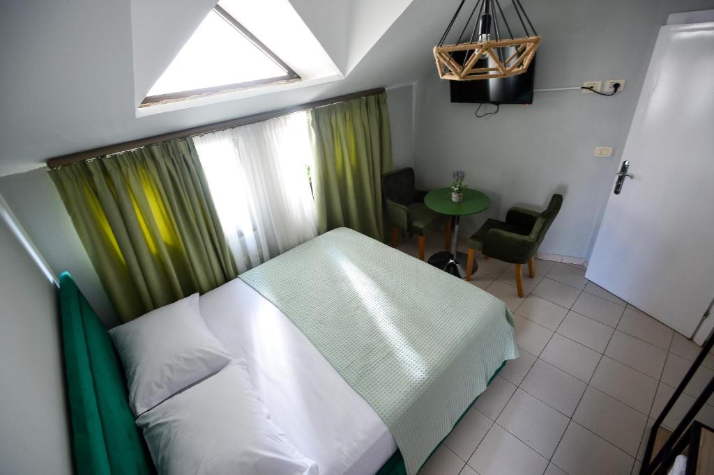 Postel nebo postele na pokoji v ubytování Hotel Niku