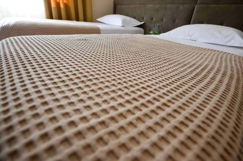 Postel nebo postele na pokoji v ubytování Hotel Niku