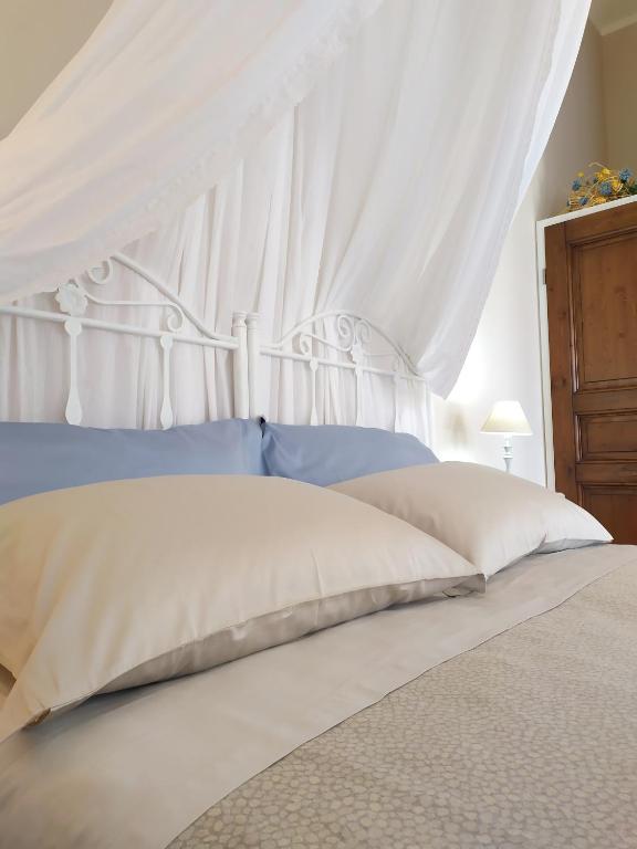 Postel nebo postele na pokoji v ubytování B&B Li Ccoti