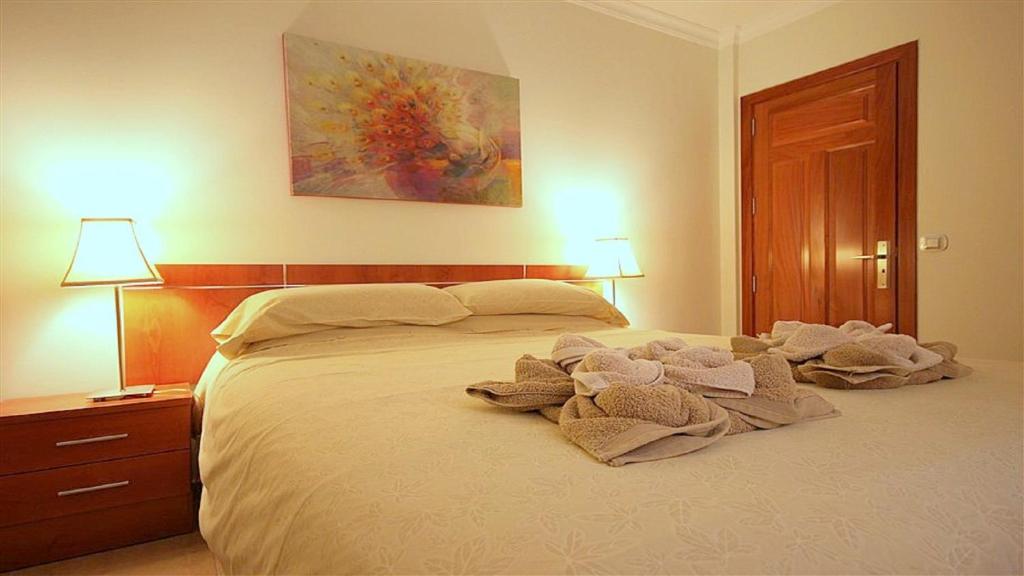 Cama o camas de una habitación en MarLenghi Apartments 3B