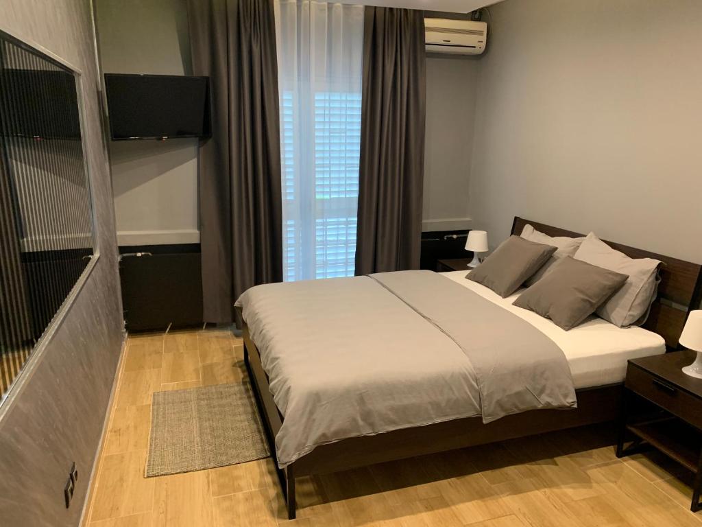 Postel nebo postele na pokoji v ubytování Motel Stari Hrast