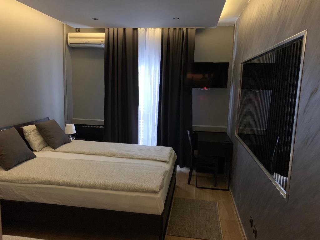 Postel nebo postele na pokoji v ubytování Motel Stari Hrast