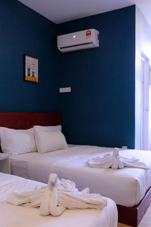 Postel nebo postele na pokoji v ubytování The b'Hotel