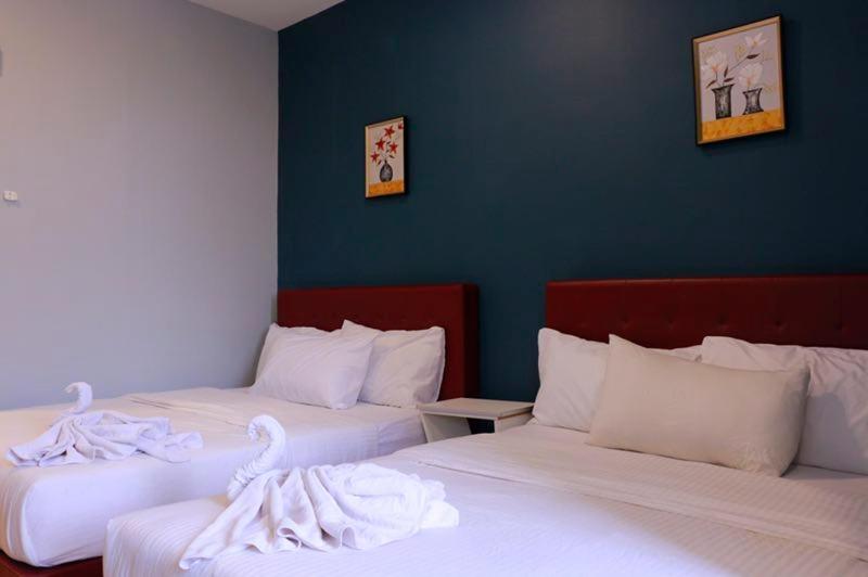 Postel nebo postele na pokoji v ubytování The b'Hotel