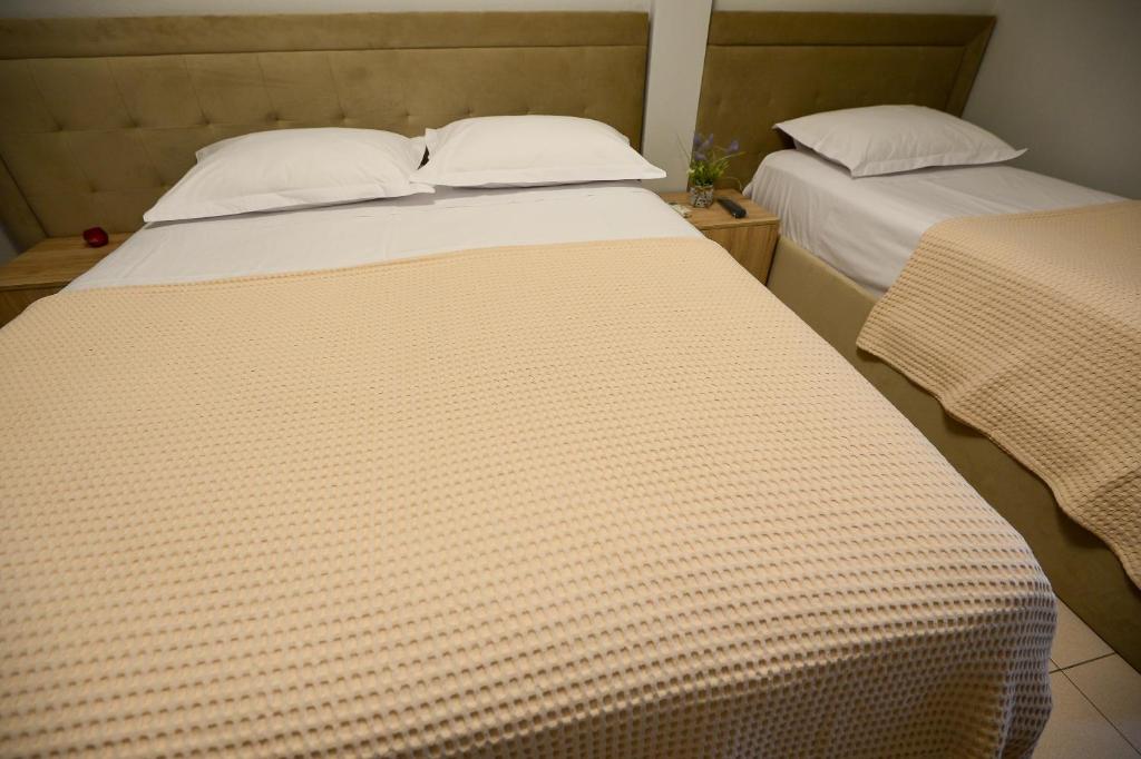 Postel nebo postele na pokoji v ubytování Hotel Niku