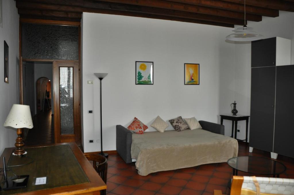 A bed or beds in a room at Appartamento Le Volte