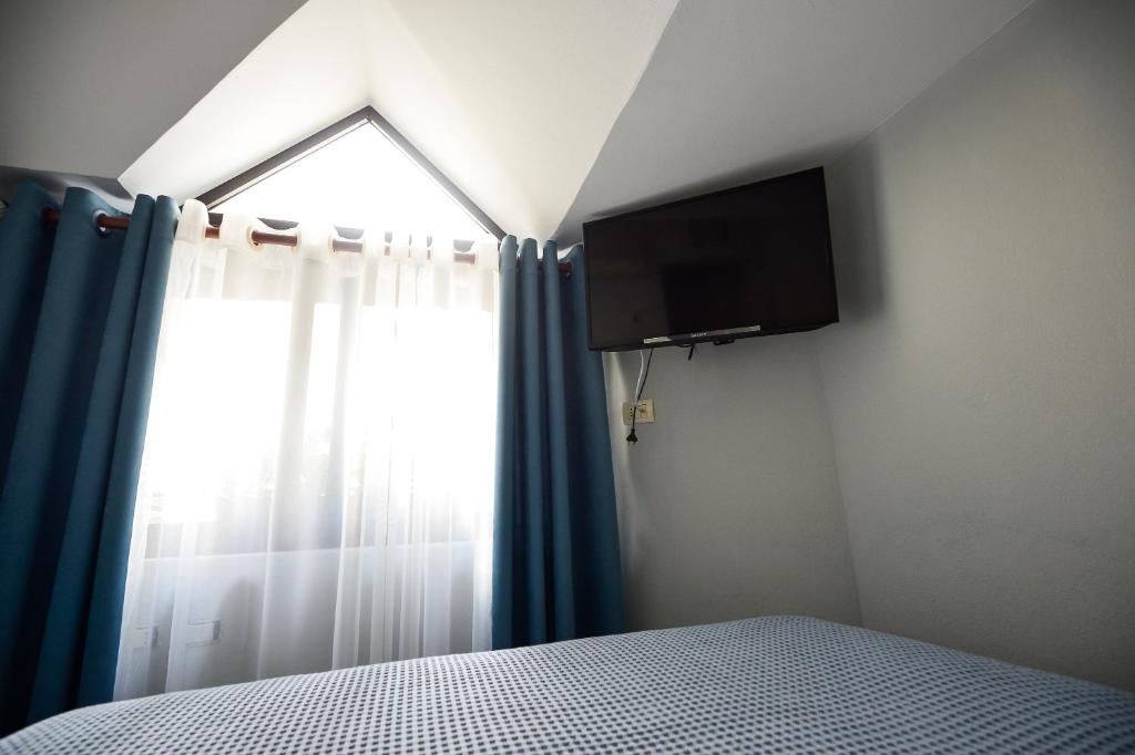 TV a/nebo společenská místnost v ubytování Hotel Niku