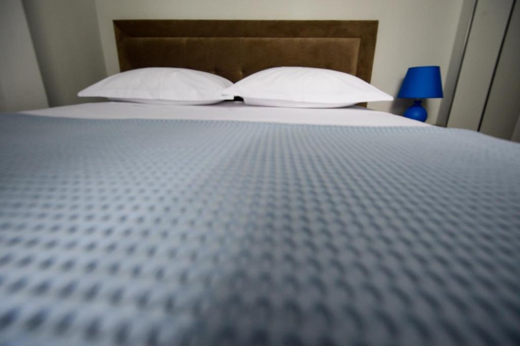 Postel nebo postele na pokoji v ubytování Hotel Niku