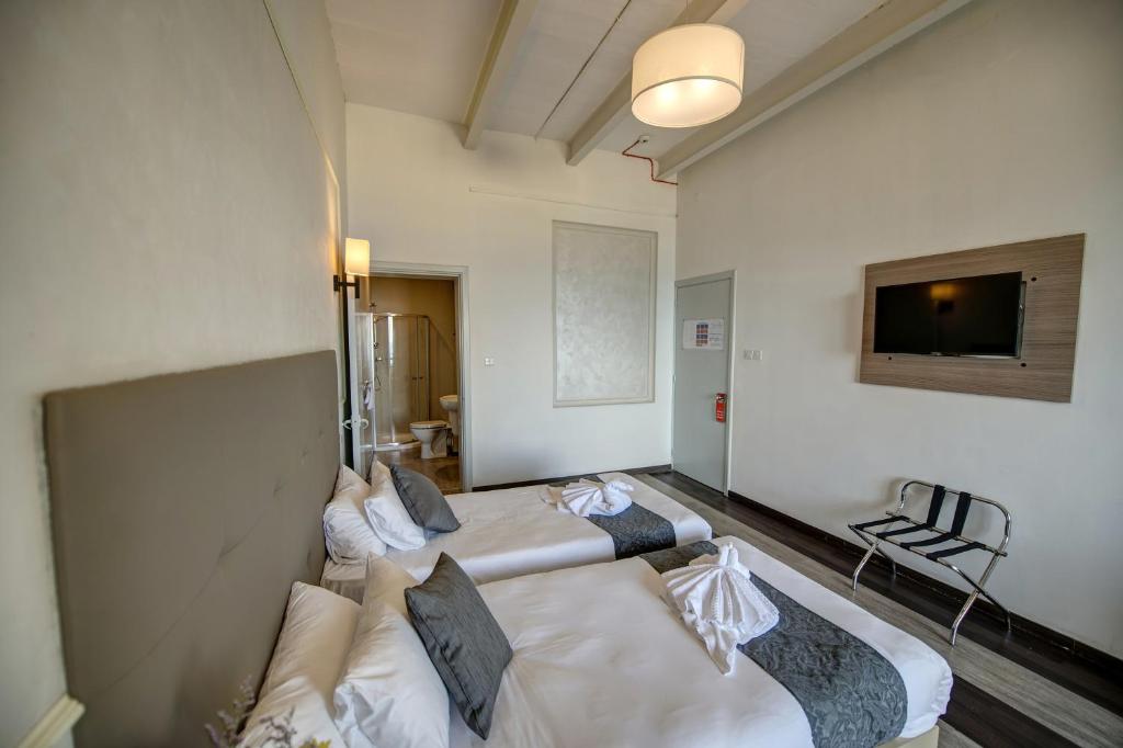 Postel nebo postele na pokoji v ubytování Europa Hotel