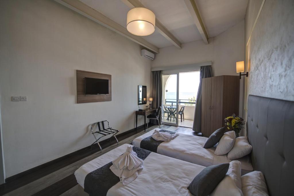 Postel nebo postele na pokoji v ubytování Europa Hotel