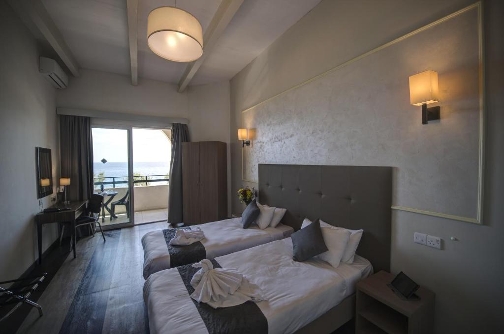 Postel nebo postele na pokoji v ubytování Europa Hotel