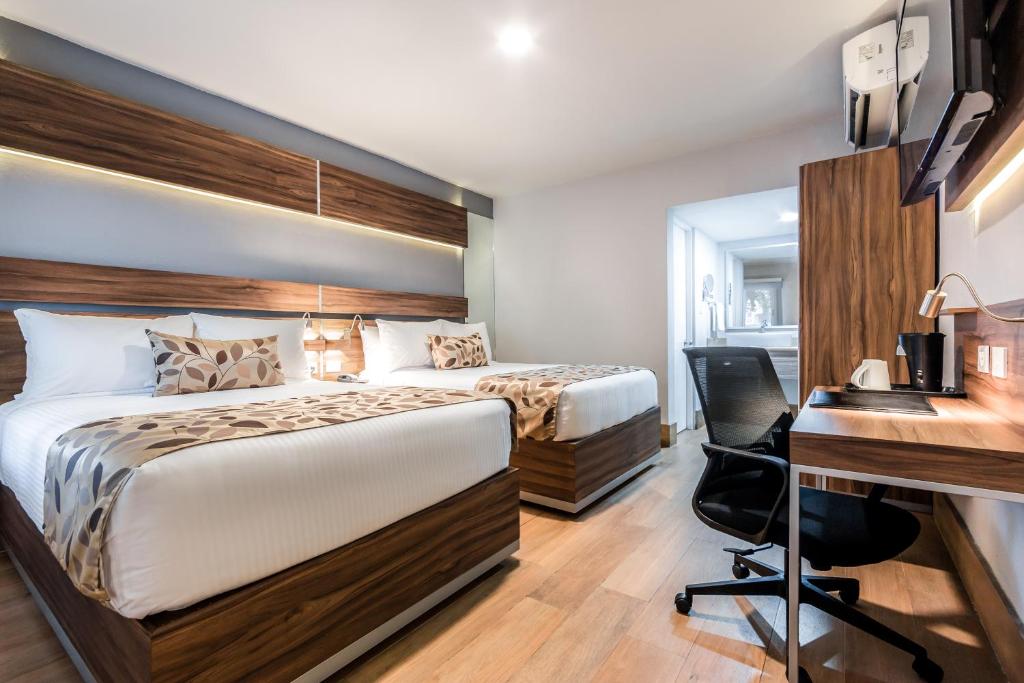 Postel nebo postele na pokoji v ubytování Sleep Inn Monterrey Norte