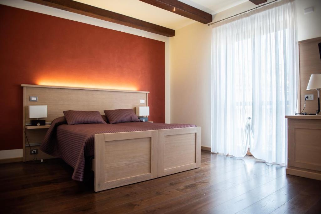 Postel nebo postele na pokoji v ubytování HOTEL - BAR DA NATALE