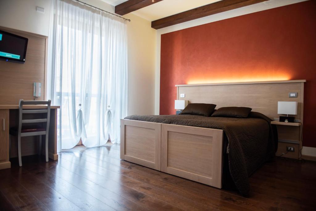 Postel nebo postele na pokoji v ubytování HOTEL - BAR DA NATALE