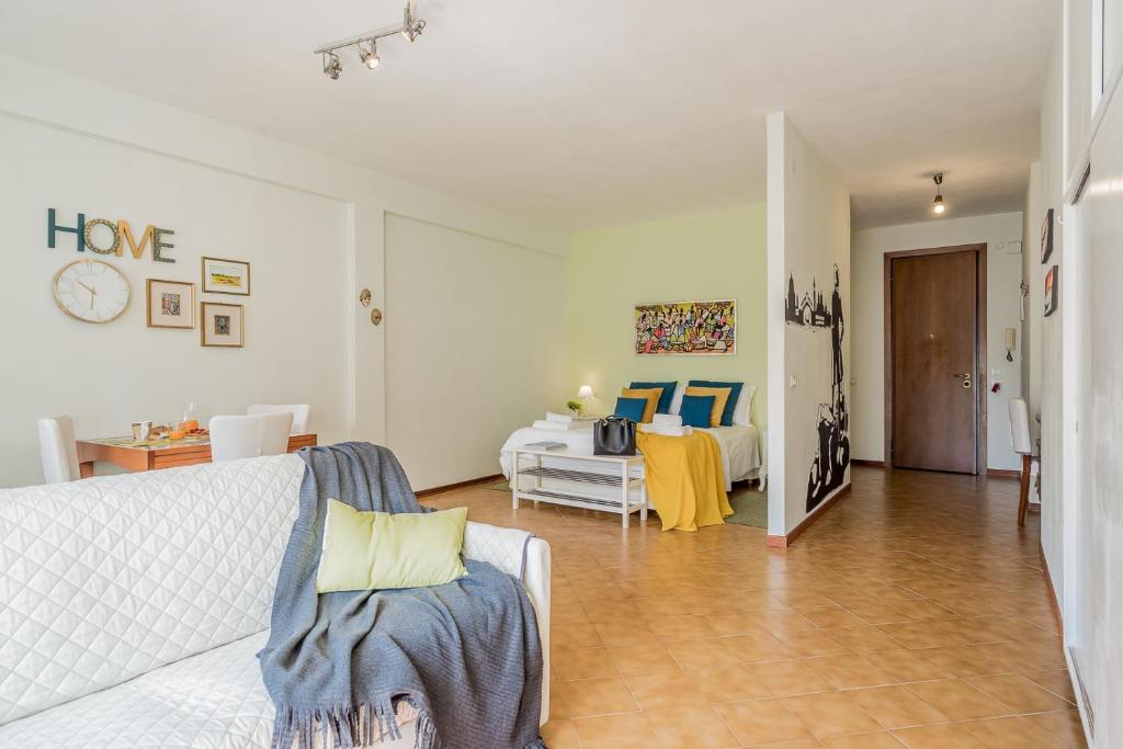 Łóżko lub łóżka w pokoju w obiekcie ARCA Conte Rosso Apartments