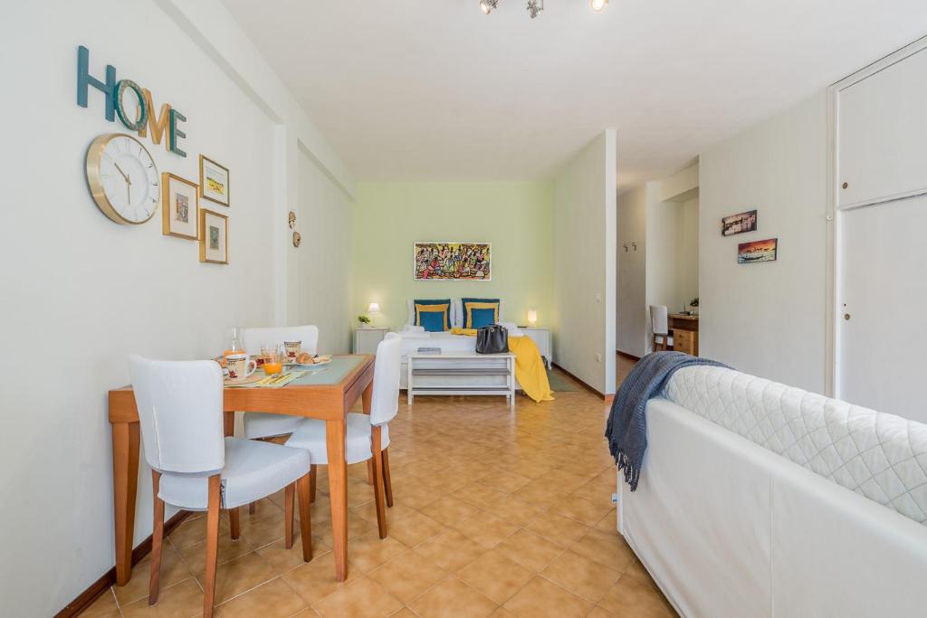 Łóżko lub łóżka w pokoju w obiekcie ARCA Conte Rosso Apartments