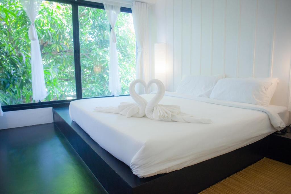 Postel nebo postele na pokoji v ubytování Trat 101 Hotel - SHA Certified