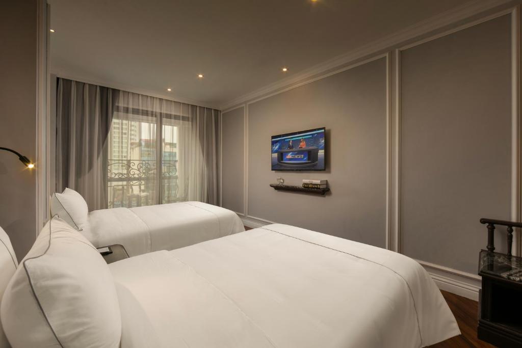 Postel nebo postele na pokoji v ubytování Canary Hotel