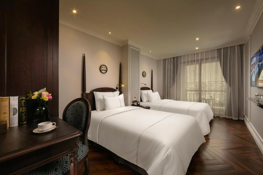 Postel nebo postele na pokoji v ubytování Canary Hotel