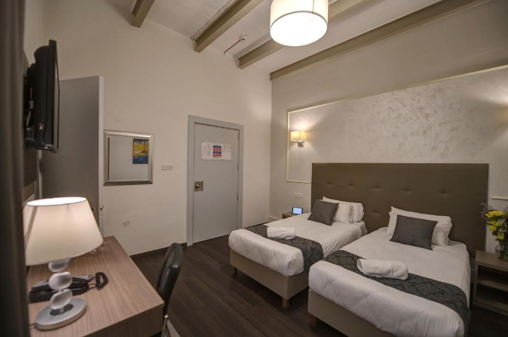Postel nebo postele na pokoji v ubytování Europa Hotel