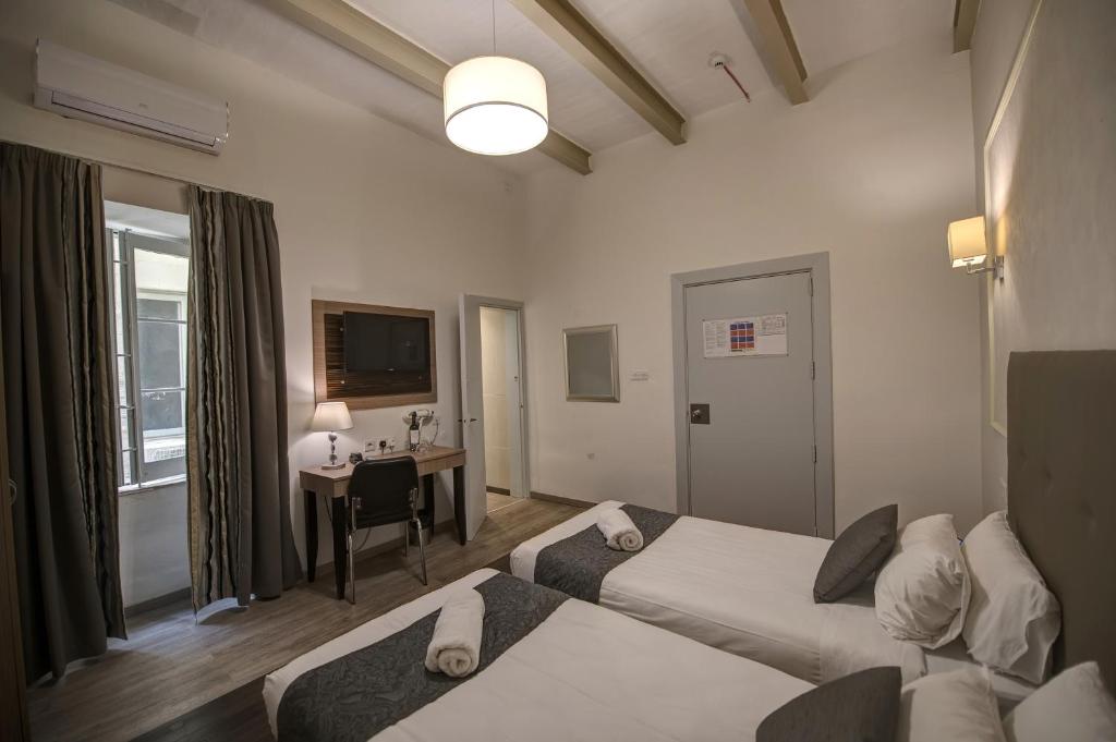 Postel nebo postele na pokoji v ubytování Europa Hotel