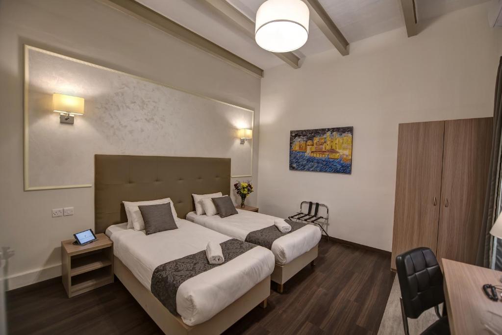 Postel nebo postele na pokoji v ubytování Europa Hotel