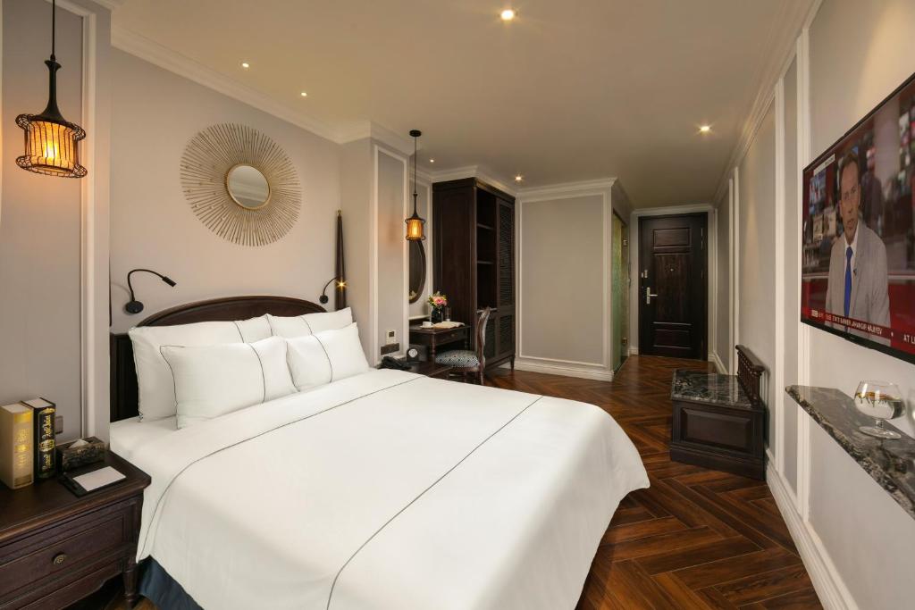 Postel nebo postele na pokoji v ubytování Canary Hotel