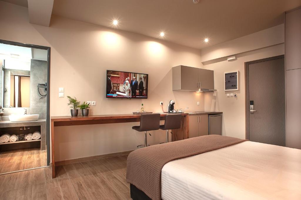 Postel nebo postele na pokoji v ubytování Pallada Athens boutique rooms & apartments