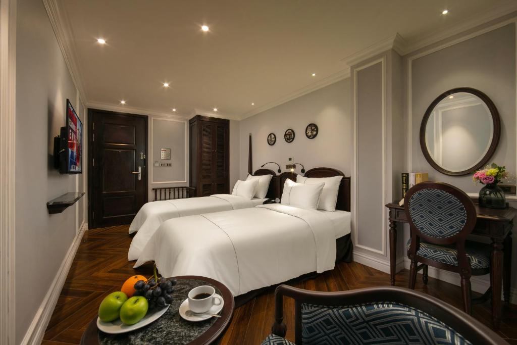 Postel nebo postele na pokoji v ubytování Canary Hotel
