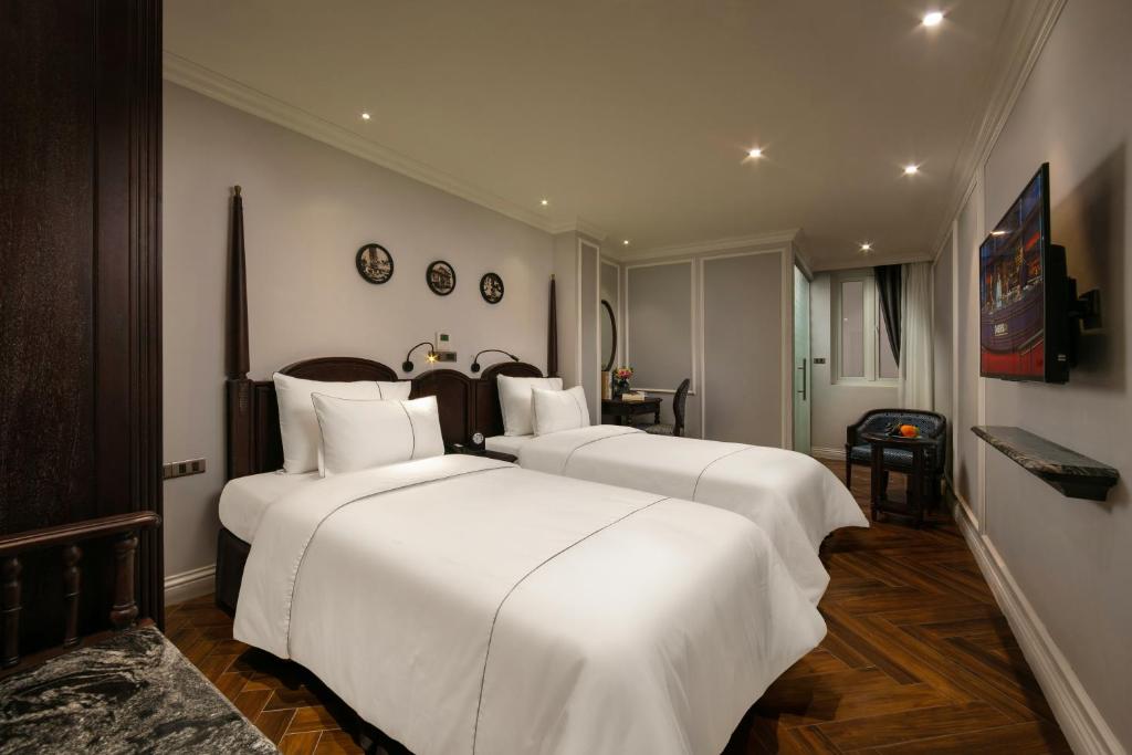 Postel nebo postele na pokoji v ubytování Canary Hotel