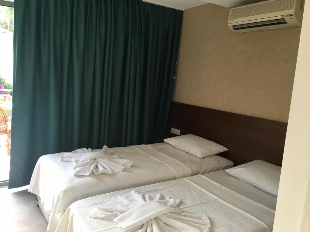 Postel nebo postele na pokoji v ubytování On Oda Oludeniz