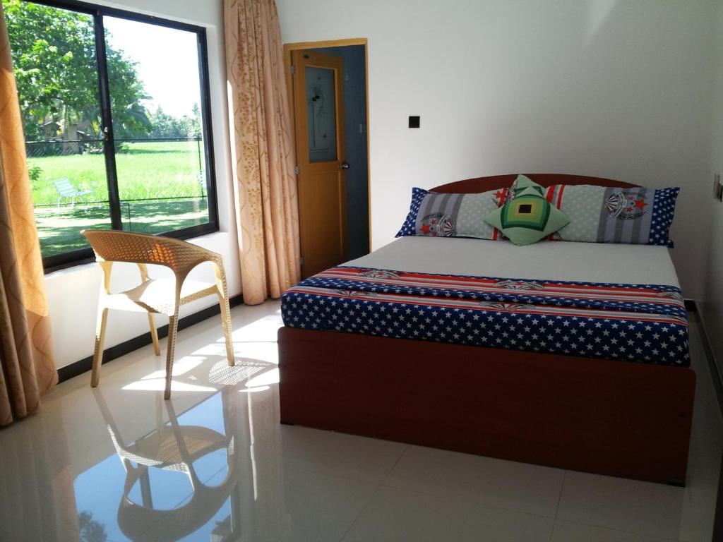 Postel nebo postele na pokoji v ubytování Moon Light Guest House