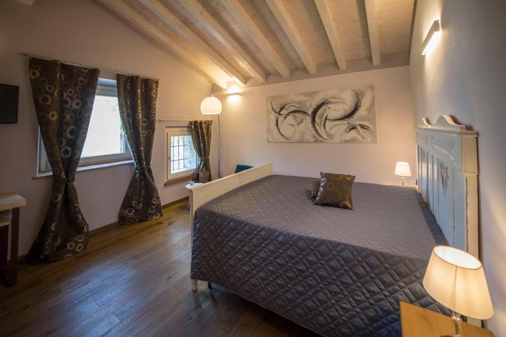 Postel nebo postele na pokoji v ubytování Agriturismo Casarai