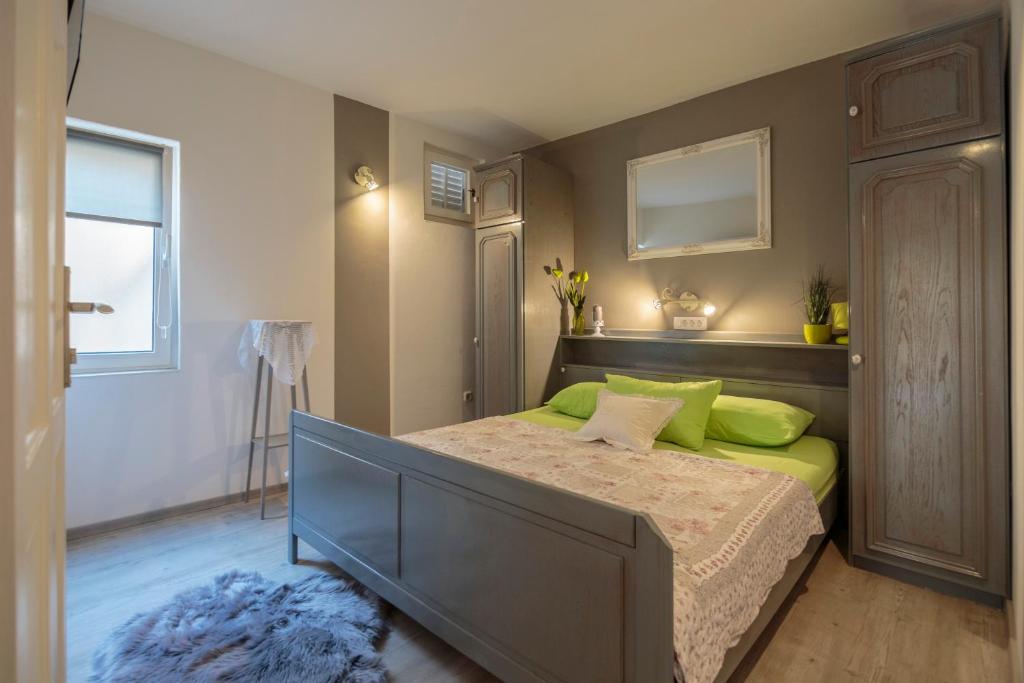 Postel nebo postele na pokoji v ubytování Apartments Villa Anka