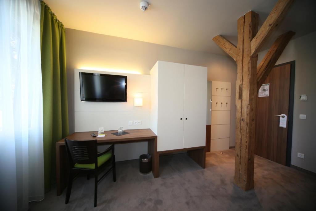 TV a/nebo společenská místnost v ubytování Hotel Kunstmühle