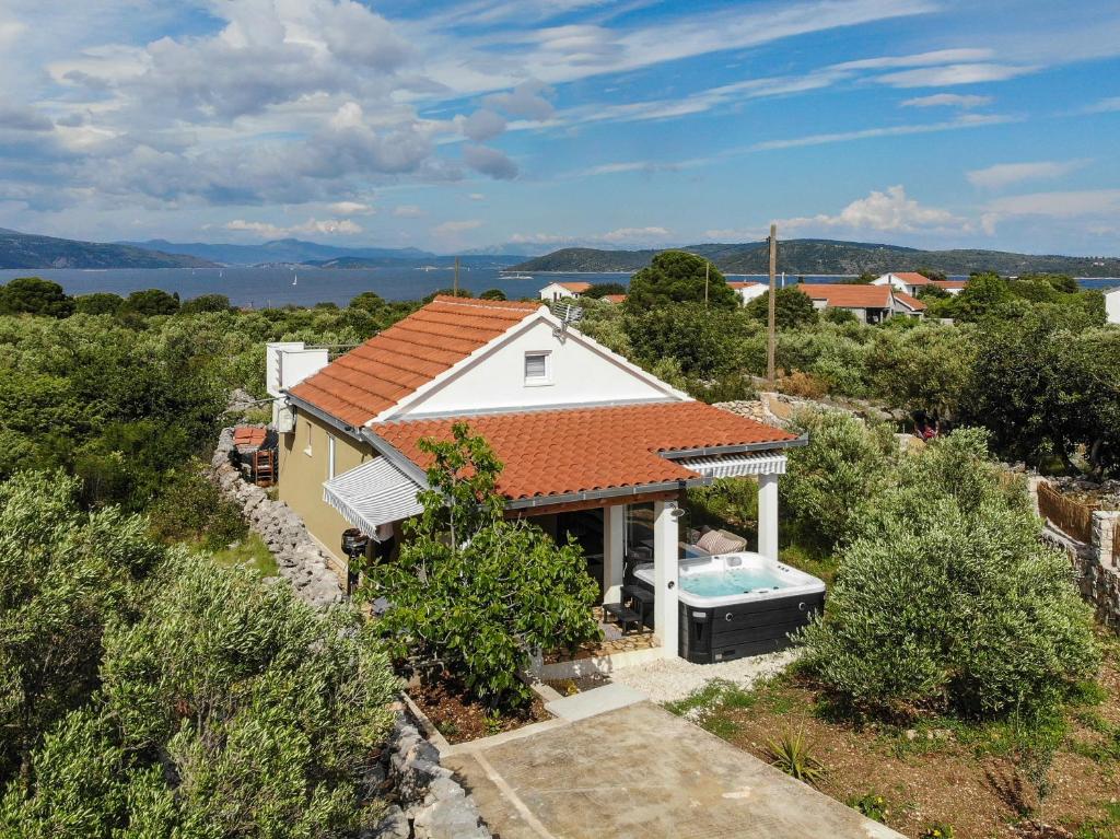 an aerial view of a house with a swimming pool at Vila Lila in Drvenik Mali