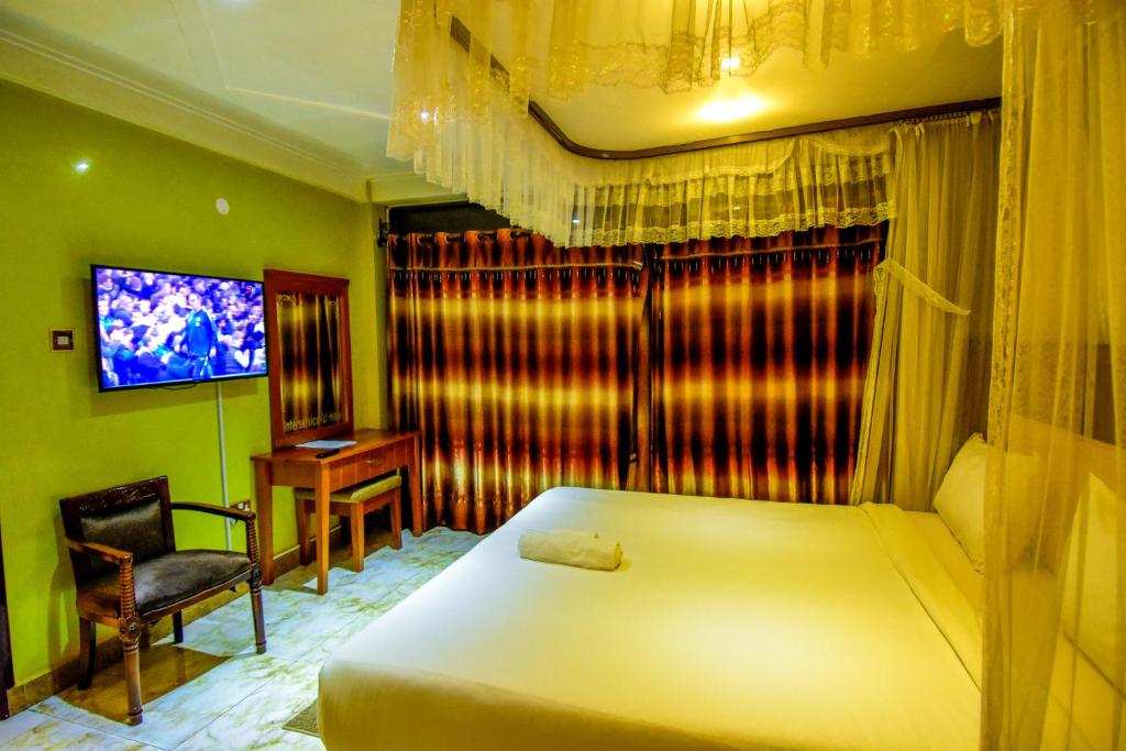 Postel nebo postele na pokoji v ubytování Interservice Hotel
