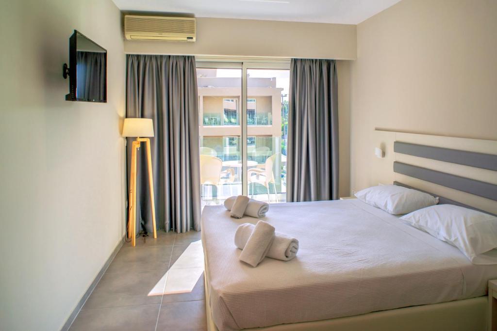 Postel nebo postele na pokoji v ubytování CNic Gemini Hotel