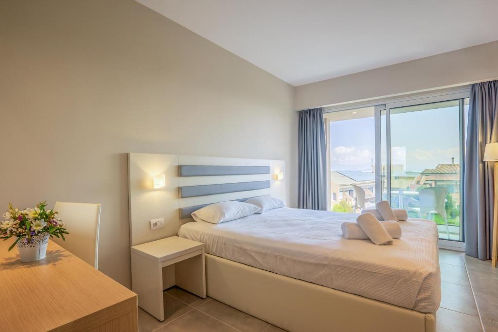 Postel nebo postele na pokoji v ubytování CNic Gemini Hotel