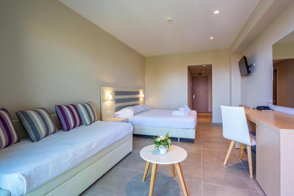 Postel nebo postele na pokoji v ubytování CNic Gemini Hotel